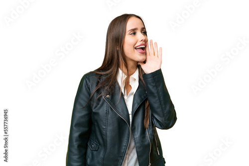 Young beautiful woman over isolated chroma key background shouting with mouth wide open to the side