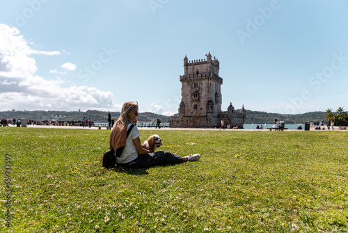 person sitting on a bench near belem tower © Jelena