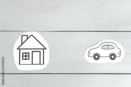 Paper house and car on a gray background