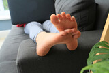 close up of girls feet on sofa
