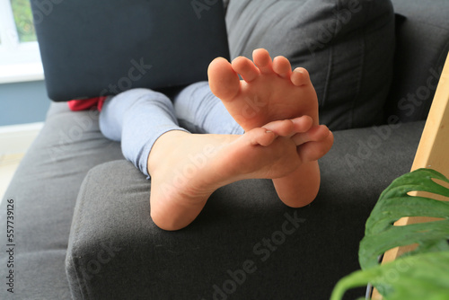 close up of girls feet on sofa