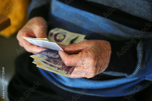 old man counting money close up of hands