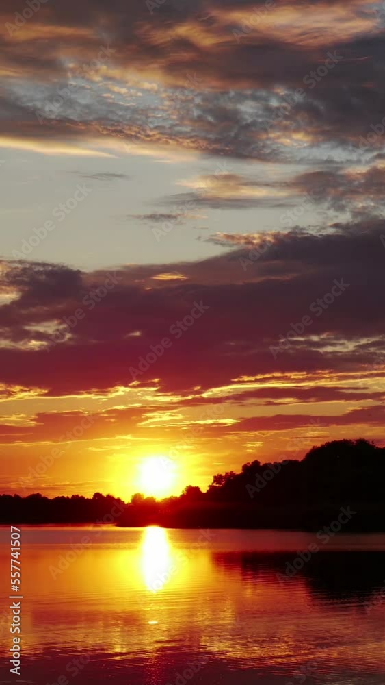 Vertical Screen: Sunset or Sunrise in the Yellow Sky. Big Bright Sun Moves in Sky. Awesome Time Lapse Landscape of Sky and Clouds with Amazing Colours. Vibrant Warm Color. Shot for Social Media Vertical Screen: Sunset or Sunrise in the Yellow Sky. Big Bright Sun Moves in Sky. Awesome Time Lapse Landscape of Sky and Clouds with Amazing Colours. Vibrant Warm Color. Shot for Social Media