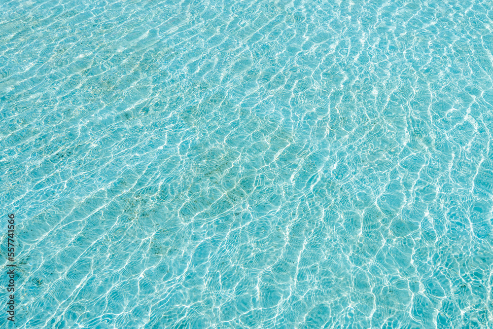 Water ripples on the surface of the swimming pool as a background.