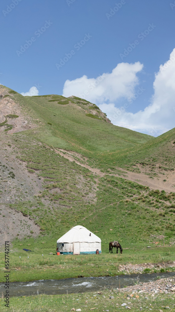 Traditional Yurt tent in Kyrgyzstan countryside. Yurt tents are traditional, portable tents made of felt that are used as a form of accommodation in the country.