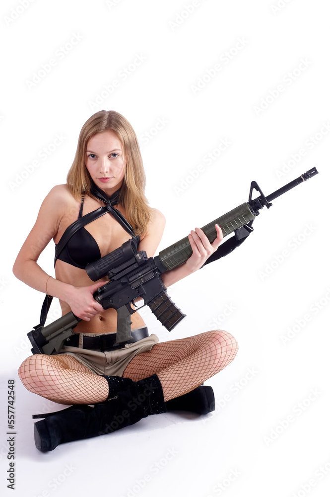 Young pretty woman with sniper rifle