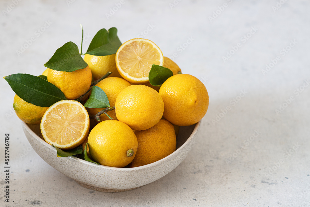 Fresh lemons in a bowl on the table