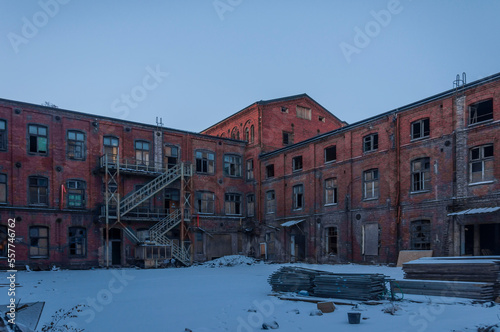 Old abandoned haunted red brick factory of stockings, pantyhose and socks in Central Europe, Poland © Arkadiusz
