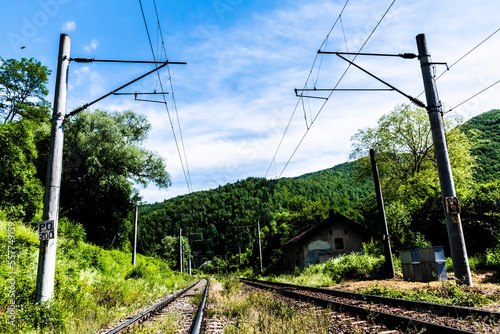 Railway lines and electricity poles. Landscape in Romania, Bolii cave area, Petrosani.