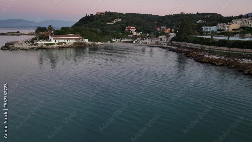Agios Spiridon Beach with crystal clear azure water and white beach in beautiful landscape scenery - in Corfu island , Ionian archipelago, Greece Agios Spiridon Beach with crystal clear azure water and white beach in beautiful landscape scenery - in Corfu island , Ionian archipelago, Greece