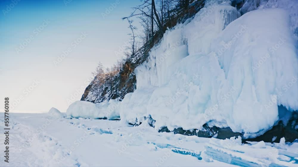 Lake Baikal, large block of frozen ice on a rock. A rare natural phenomenon. Baikal, Siberia, Russia. Aerial drone shot 4k Lake Baikal, large block of frozen ice on a rock. A rare natural phenomenon. Baikal, Siberia, Russia. Aerial drone shot 4k