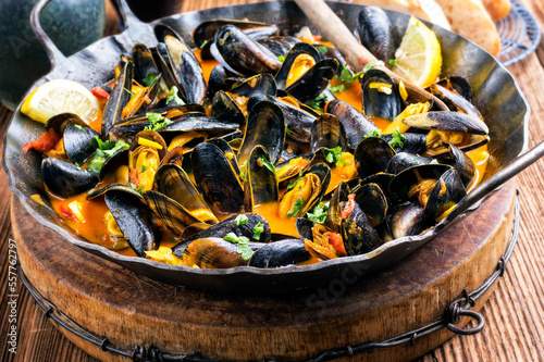 Fotografie, Obraz Traditional Italian sailors mussel in white wine sauce with vegetables and saffr