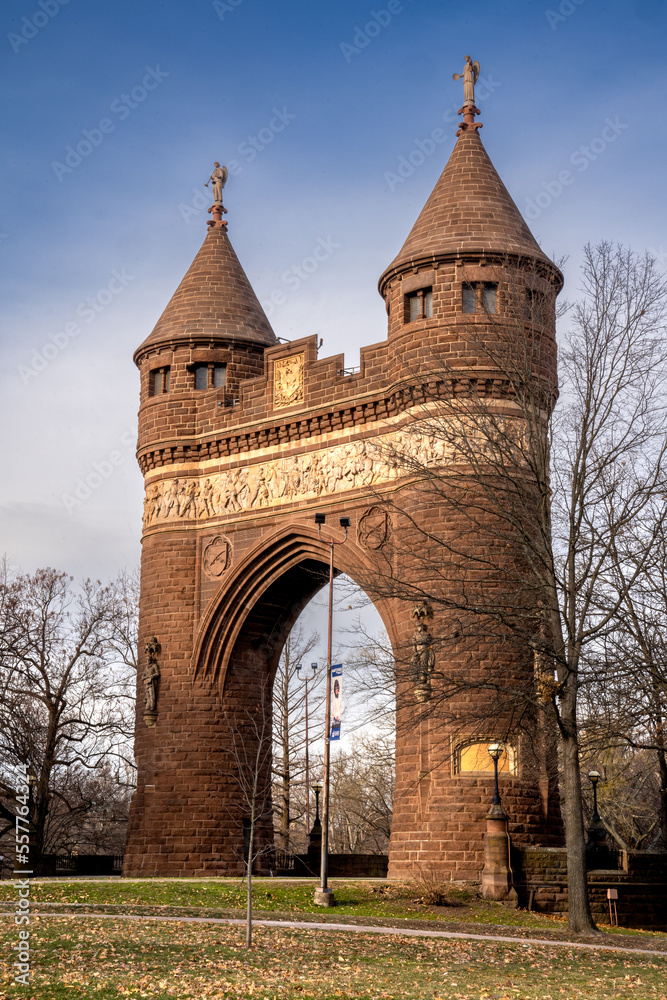 Hartford, CT - USA - Dec 28, 2022 View of the The Soldiers and Sailors Memorial Arch in Bushnell Park, an eclectic design with two Norman towers and a Gothic arch, decorated with a classical frieze.