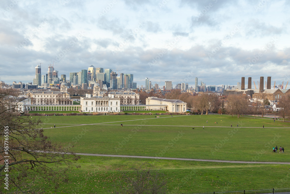 Greenwich park, Royal Navy college and Queen palace, and Canary Wharf business international finance aria on the background 