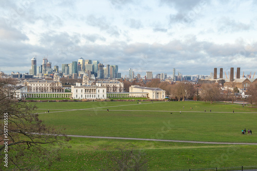 Greenwich park, Royal Navy college and Queen palace, and Canary Wharf business international finance aria on the background 