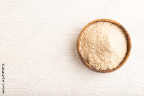 Powdered milk and buckwheat baby food mix, on white wooden, top view, copy space