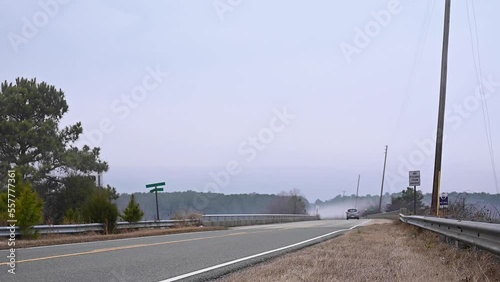 Foggy Road with Car and Truck Passing By - 4K