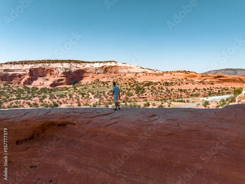 Young man standing in the Arches National Park in Arizona, USA. Amazing rock formation - The Wave. Parya Canyon Vermillion Cliffs, Coyote Buttes Wilderness