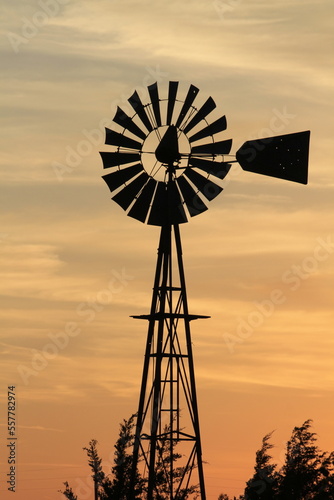 Kansas Farm Windmill at Sunset with clouds