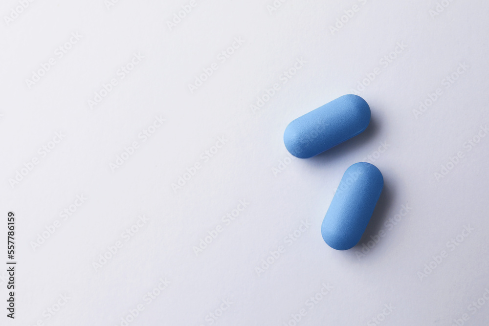 Pills and space for text on white background, top view. Potency problem Pills and space for text on white background, top view. Potency problem