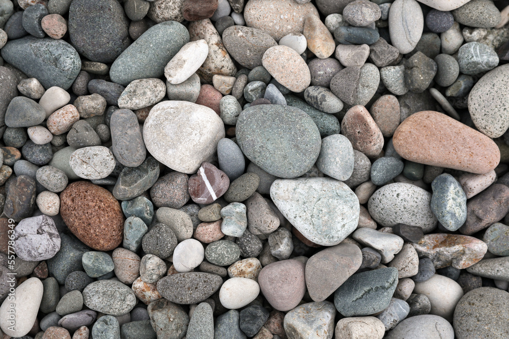 Many different pebbles as background, top view Many different pebbles as background, top view