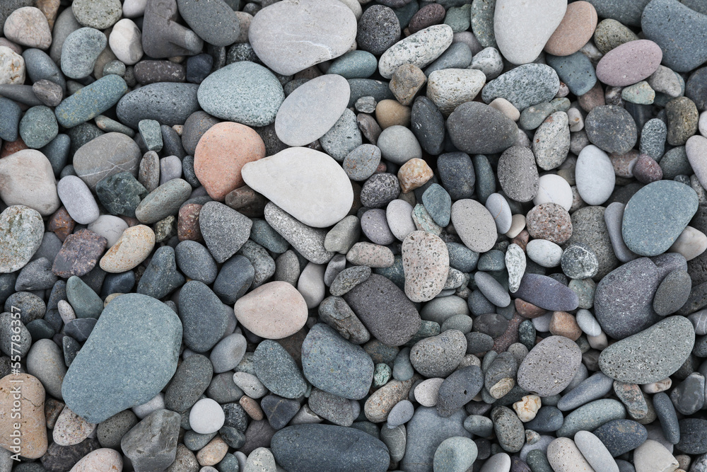 Many different pebbles as background, top view Many different pebbles as background, top view