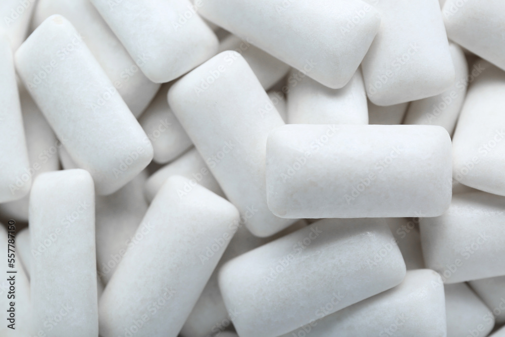 Tasty white chewing gums as background, top view Tasty white chewing gums as background, top view