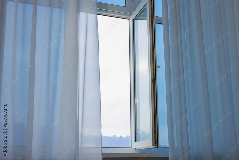 Open window and elegant white curtains indoors. Interior design Open window and elegant white curtains indoors. Interior design