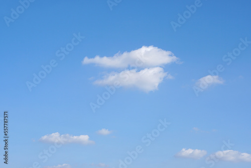 Blue sky with fluffy white clouds constantly changing shape.