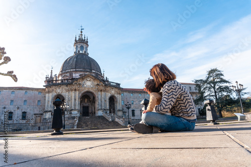 Sitting on the ground looking at the Sanctuary of Loyola, Baroque church of Azpeitia