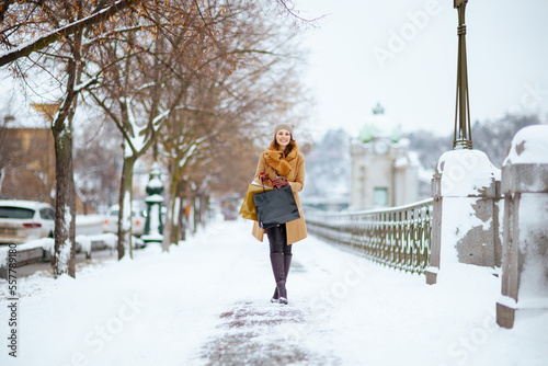 happy stylish woman in brown hat and scarf © Alliance