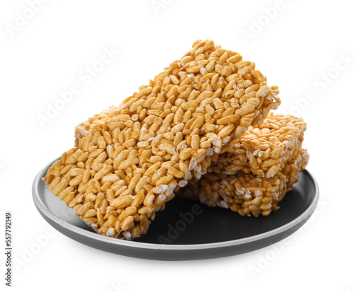 Plate with puffed rice bars (kozinaki) on white background