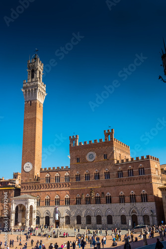 Tourists enjoy Piazza del Campo square in Siena, Italy. The historic centre of Siena has been declared by UNESCO a World Heritage Site.