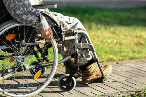 Young soldier in wheelchair...