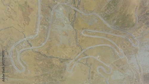 Aerial top view of the famous Transfagarash mountain road under fog and clouds in Romania, 4k photo