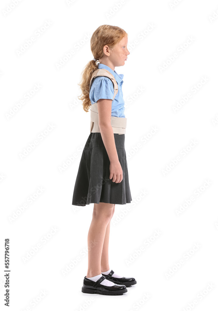 Little schoolgirl in back brace on white background Little schoolgirl in back brace on white background