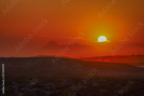 Sunset behind the mountains. Standing out is Pedra do Elefante  one of the main tourist attractions in Maric    located in the state of Rio de Janeiro.