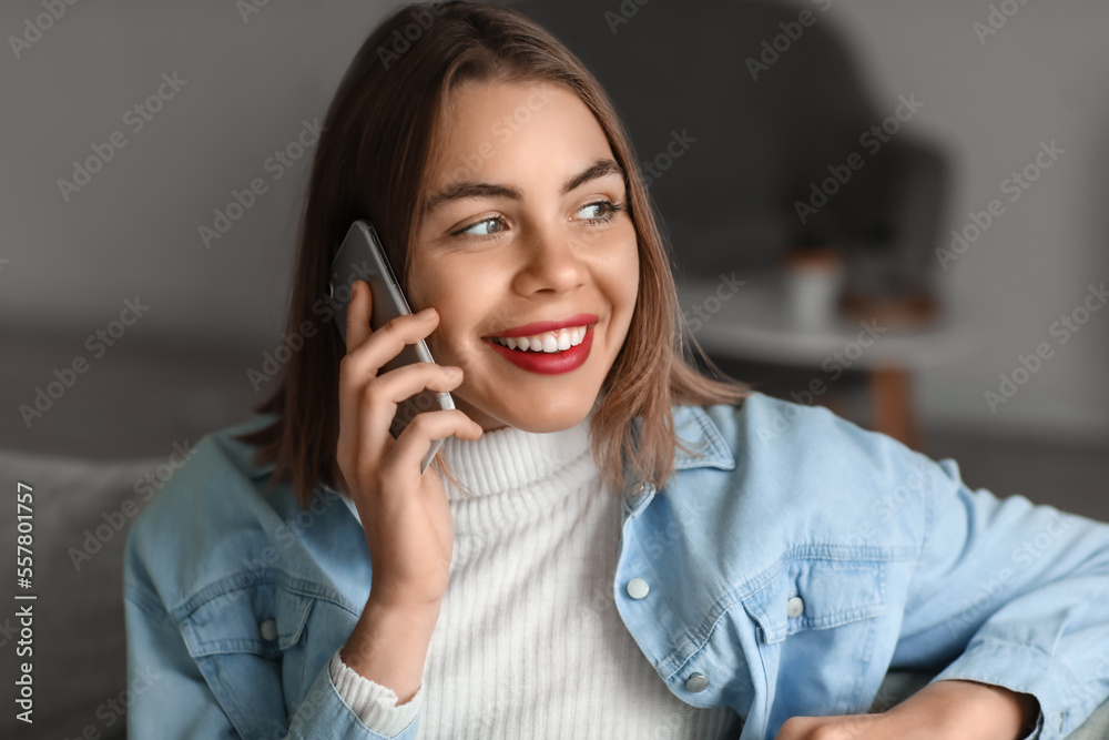 Young woman talking by smartphone at home, closeup Young woman talking by smartphone at home, closeup
