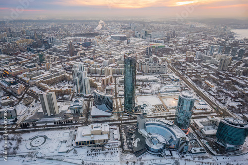 Yekaterinburg city with Buildings of Regional Government and Parliament  Dramatic Theatre  Iset Tower  Yeltsin Center  panoramic view at winter sunset.