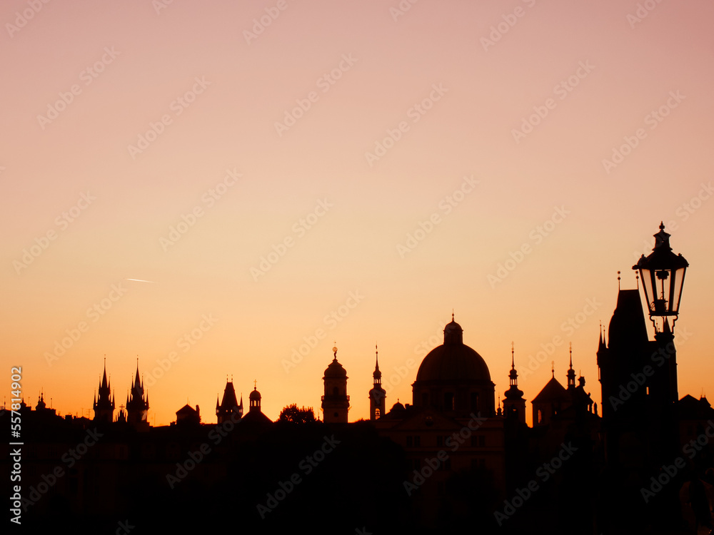 Sunrise silhouette of the pretty skyline of Prague taken from the Charles Bridge in the old town.