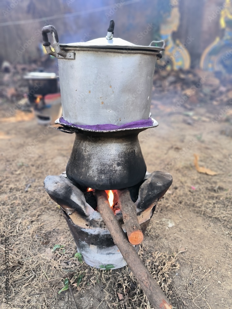 Traditional cooking of rice using firewood in Thailand. Traditional cooking of rice using firewood in Thailand.