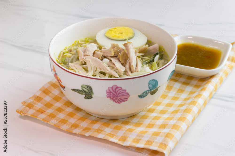 Chicken Soto with chili sauce or Soto Ayam in Indonesia. Soto ayam is a traditional Indonesian food Chicken Soto with chili sauce or Soto Ayam in Indonesia. Soto ayam is a traditional Indonesian food
