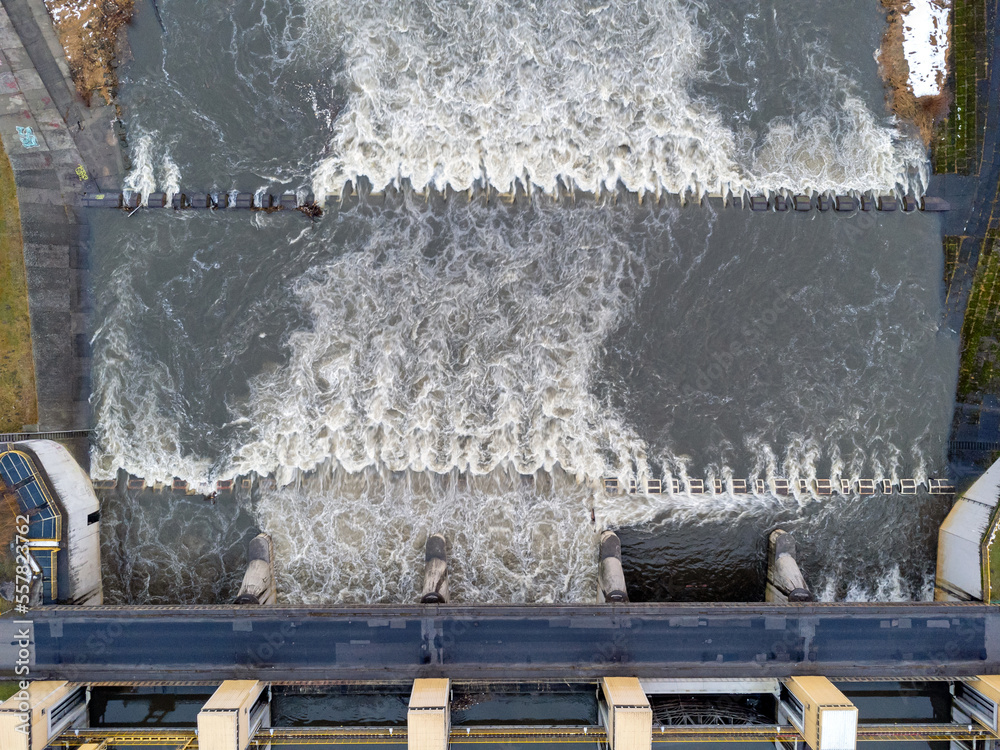 Aerial view. Dam, rushing river, water, landscape, nature, street, bridge, winter.