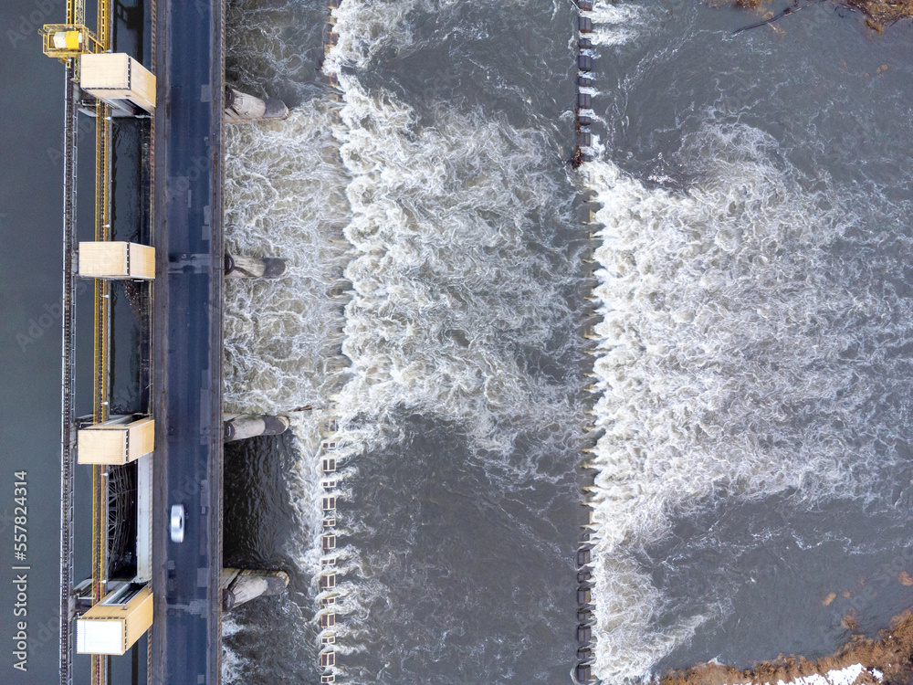 Aerial view. Dam, rushing river, water, landscape, nature, street, bridge, winter.
