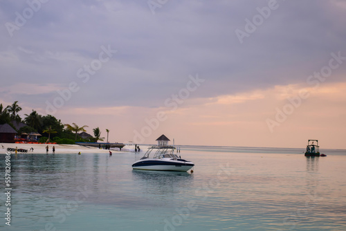 Beautiful Tropical sunset landscape in Maldives island Baa , with infinity Indian ocean sea water view and cloudy skies , perfect Honeymoon travel destination  © Youssef