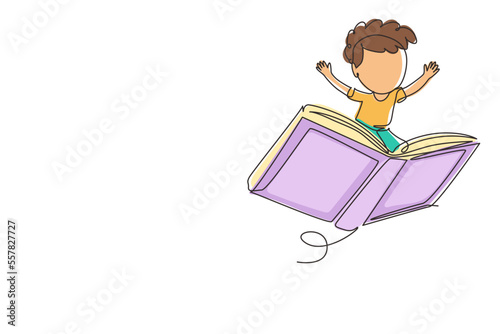 Continuous one line drawing happy smiling preschooler kid boy flying on big open book. Children riding magical flying book. Knowledge power concept. Single line draw design vector graphic illustration