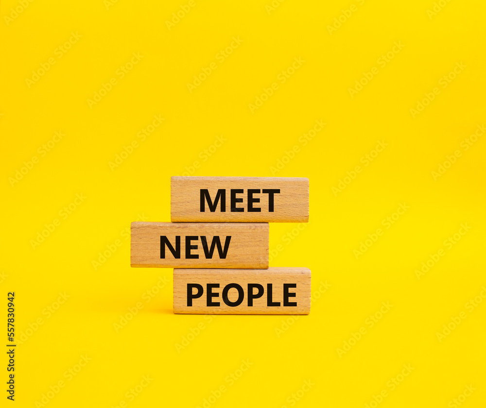 Meet new people symbol. Concept word Meet new people on wooden blocks. Beautiful yellow background. Business and Meet new people concept. Copy space Meet new people symbol. Concept word Meet new people on wooden blocks. Beautiful yellow background. Business and Meet new people concept. Copy space