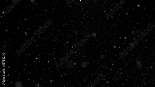 Super Slow Motion Shot of Real Snow Falling Down Isolated on Black Background at 1000fps. photo