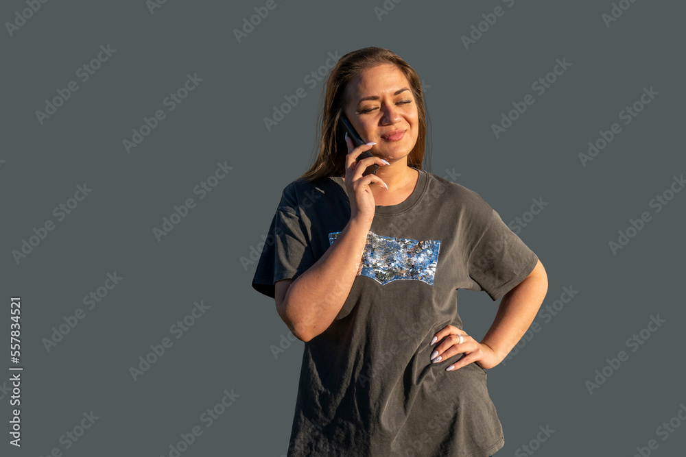 Young woman with a telephone - talking, writes a message, looks into the smartphone Young woman with a telephone - talking, writes a message, looks into the smartphone