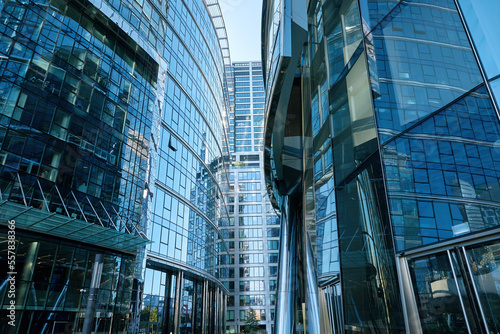 Detail of skyscraper office buildings with glass facades. Modern urban architecture. High rise building in downtown of Warsaw city